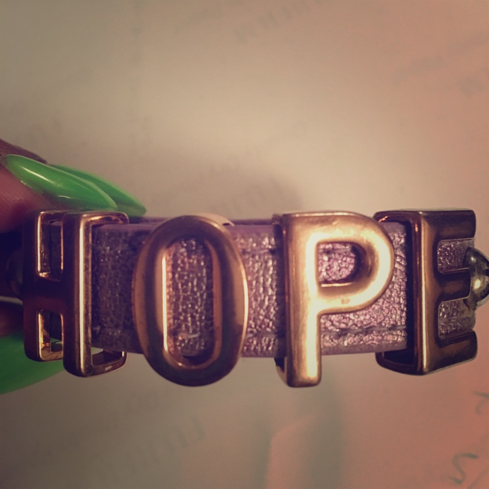 BCBG snap button bracelet displaying, “HOPE”.